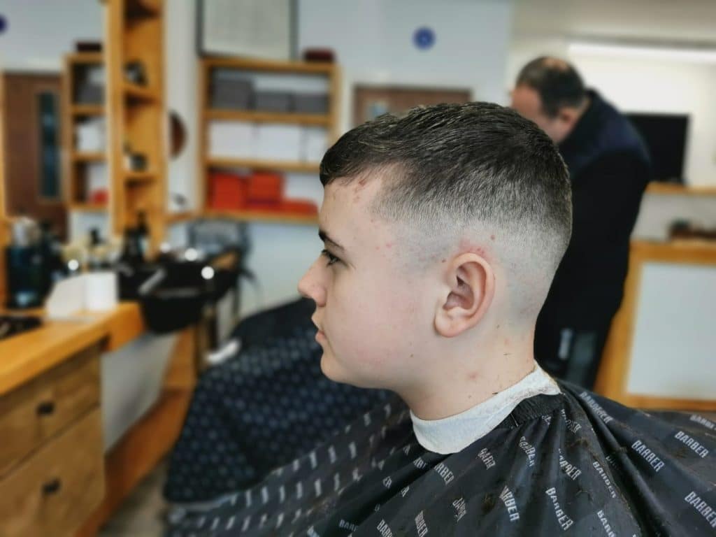 Boy’s haircut with a tidy fade at Old Town Barbers