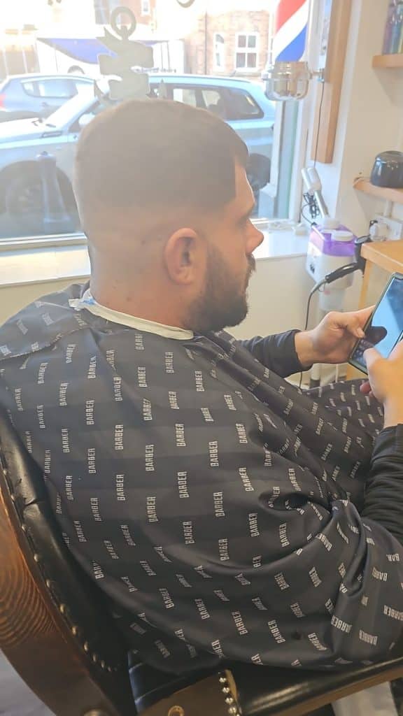 Barber working on a customer’s haircut at Old Town Barbers