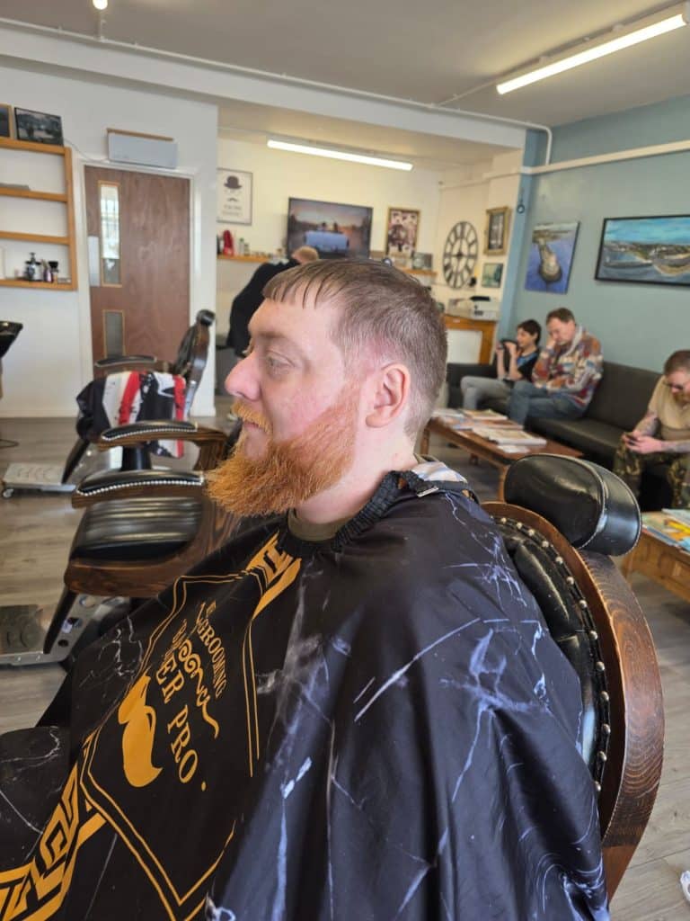 Customer with a fresh beard trim at Old Town Barbers